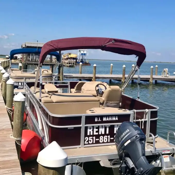 a boat on a body of water next to a dock