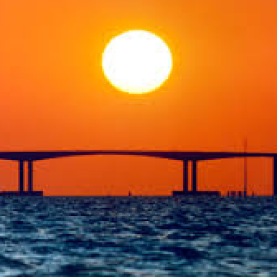 a sunset over a body of water